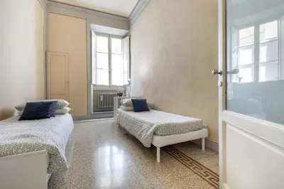 Letto o letti in una camera di Medicean Florence Apartment