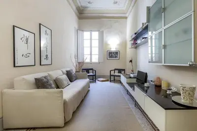 Area soggiorno di Medicean Florence Apartment