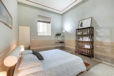 Letto o letti in una camera di Medicean Florence Apartment