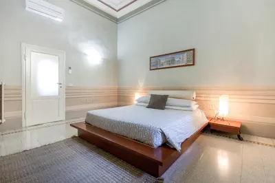 Letto o letti in una camera di Medicean Florence Apartment