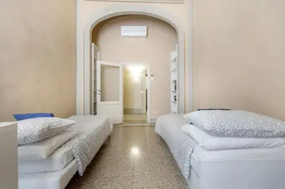 Letto o letti in una camera di Medicean Florence Apartment