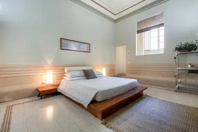 Letto o letti in una camera di Medicean Florence Apartment