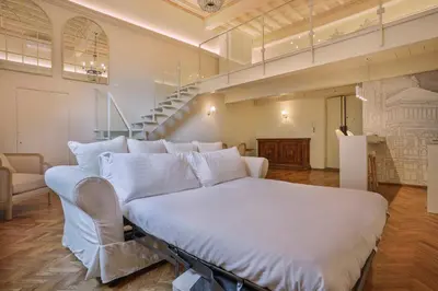 Letto o letti in una camera di Palazzo Galli Tassi Collection - Loft 1