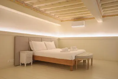 Letto o letti in una camera di Palazzo Galli Tassi Collection - Loft 1