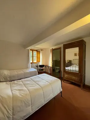 Letto o letti in una camera di Casa per la Pace