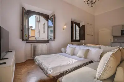 Letto o letti in una camera di Palazzo Galli Tassi Collection - Loft 2
