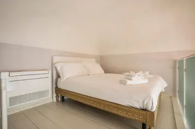 Letto o letti in una camera di Palazzo Galli Tassi Collection - Loft 3