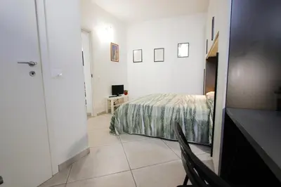 Letto o letti in una camera di Suite dei Vanni con parcheggio privato gratuito