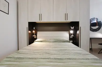 Letto o letti in una camera di Suite dei Vanni con parcheggio privato gratuito
