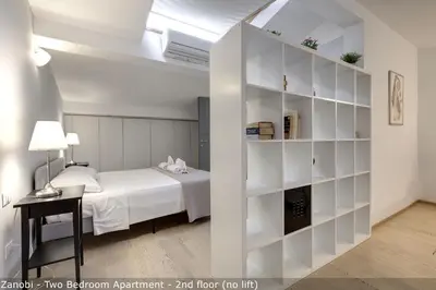 Letto o letti in una camera di San Zanobi Apartments by Mamo Florence