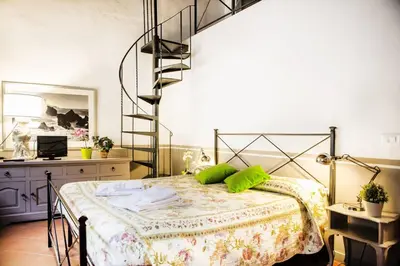 Letto o letti in una camera di Family & Friends Base Near Florence Station