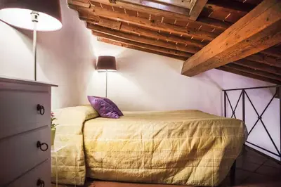Letto o letti in una camera di Family & Friends Base Near Florence Station