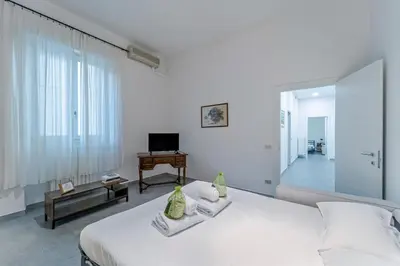 Letto o letti in una camera di UNYCA - San Domenico Florence Apartment