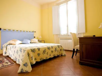 Letto o letti in una camera di Apartment Wohnung 'San Firenze' mit Waschmaschine by Interhome