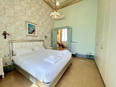 Letto o letti in una camera di Apartment Florentine Penthouse von FlorenceHospitality by Interhome