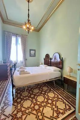 Letto o letti in una camera di Apartment Florentine Penthouse von FlorenceHospitality by Interhome