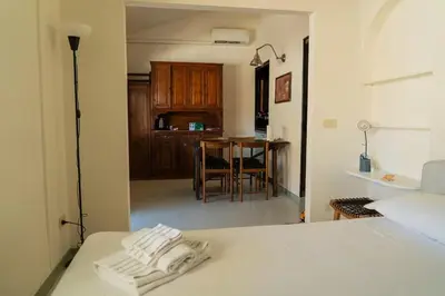 Letto o letti in una camera di Cute & small 1-BR apt with beautiful terrace