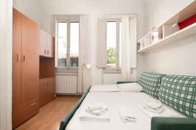 Letto o letti in una camera di Ognissanti Essential Studio Apartment