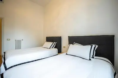 Letto o letti in una camera di Prestige Gallery Residence-Florence Center