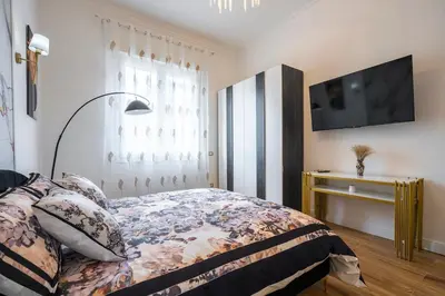 Letto o letti in una camera di Prestige Gallery Residence-Florence Center