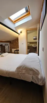 Letto o letti in una camera di ViviLafirenze G
