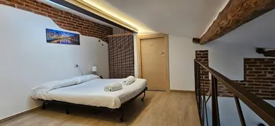 Letto o letti in una camera di ViviLafirenze G
