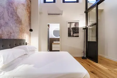 Letto o letti in una camera di Alinari Urban Adapartment Collection
