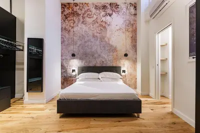 Letto o letti in una camera di Alinari Urban Adapartment Collection