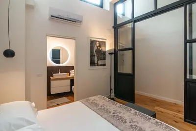 Letto o letti in una camera di Alinari Urban Adapartment Collection