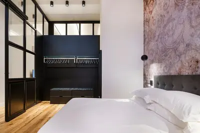 Letto o letti in una camera di Alinari Urban Adapartment Collection