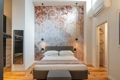 Letto o letti in una camera di Alinari Urban Adapartment Collection