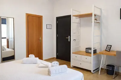 Letto o letti in una camera di Hotiday Firenze Vespucci