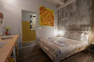 Letto o letti in una camera di BBH Firenze
