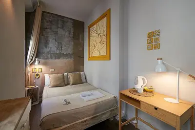 Letto o letti in una camera di BBH Firenze