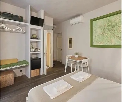 Letto o letti in una camera di BBH Firenze