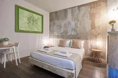 Letto o letti in una camera di BBH Firenze