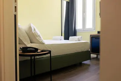 Letto o letti in una camera di JR Hotels Hermes Firenze