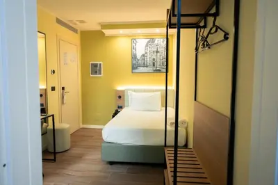 Letto o letti in una camera di JR Hotels Hermes Firenze