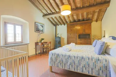 Letto o letti in una camera di Farmhouse With Pool Amongst Chianti Vineyards