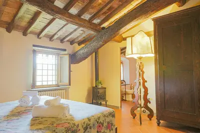 Letto o letti in una camera di Farmhouse With Pool Amongst Chianti Vineyards