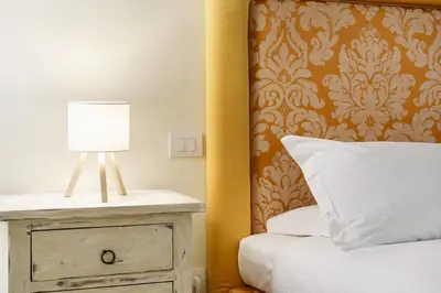 Letto o letti in una camera di Michelangelo Elegant Homes in Santa Croce