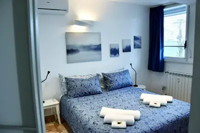 Letto o letti in una camera di Rose apartment - 5 min centro - comfort ed eleganza