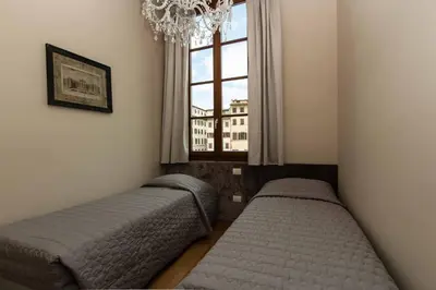 Letto o letti in una camera di Maison Alighieri