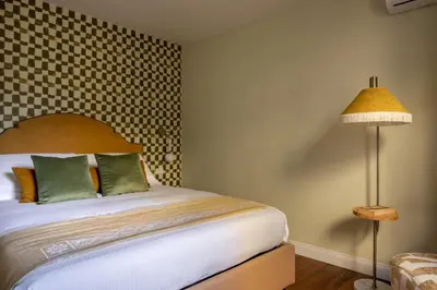 Letto o letti in una camera di Geometric Design Suite by Maison Florence