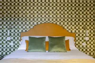 Letto o letti in una camera di Geometric Design Suite by Maison Florence