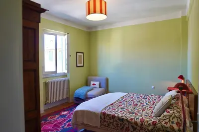 Letto o letti in una camera di The gardener - charming cottage