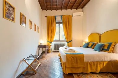 Letto o letti in una camera di Dimora Donati