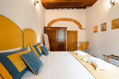 Letto o letti in una camera di Dimora Donati