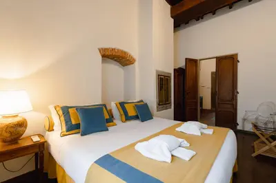 Letto o letti in una camera di Dimora Donati