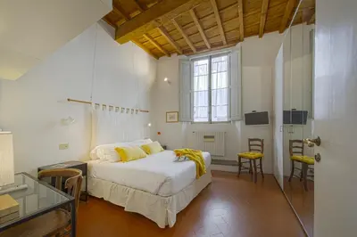 Letto o letti in una camera di Bombarde - Flo Apartments